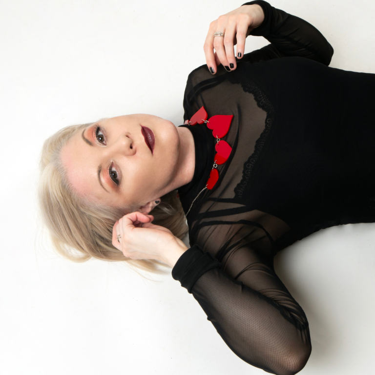 Laura is lying on the ground looking up